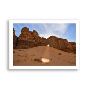 The setting sun shines through "The Oculus" in AlUla, Saudi Arabia